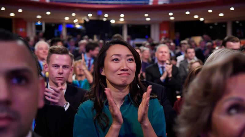 The wife of Britain’s foreign secretary, Jeremy Hunt, Lucia Guo, reacts after her husband’s address. Photograph: Toby Melville/Reuters