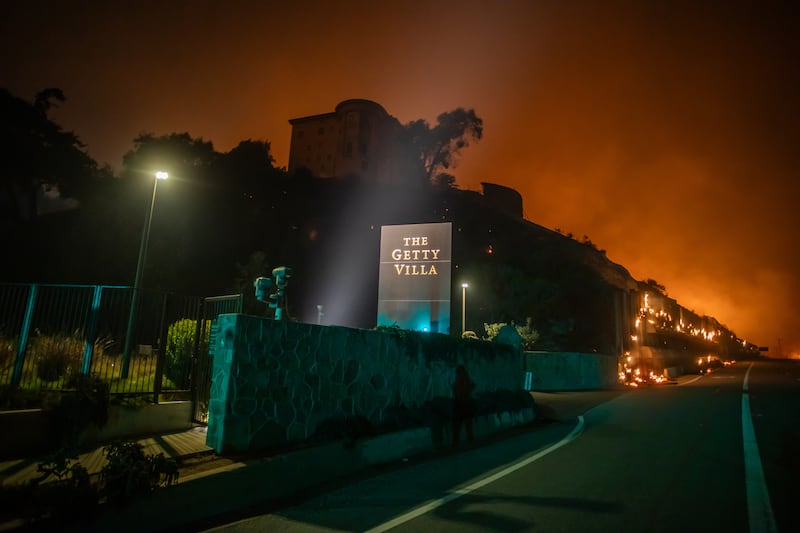 Flames from the Palisades Fire reach the grounds of the Getty Villa Museum on the Pacific Coast Highway in Los Angeles on Wednesday. Photograph: Apu Gomes/Getty Images