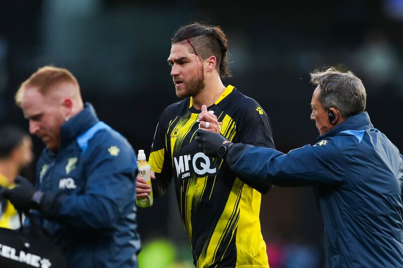 Watford's Francisco Sierralta receives treatment during Watford's Championship game against Millwall at Vicarage Road. Photograph:: Rhianna Chadwick/PA