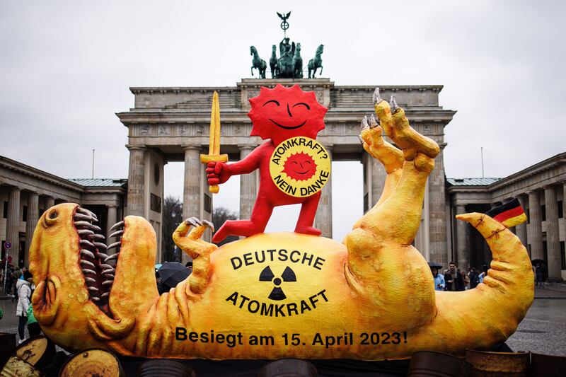 Greenpeace displayed a sculpture of a dinosaur, designed by German artist Jacques Tilly, during a protest to mark the day of the nuclear power phase-out in Germany. Photograph: Clemens Bilan/EPA