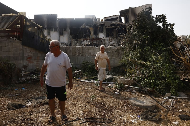 Local residents look at the damage to a police station destroyed by Palestinian militants in Sderot, Israel. Photograph: Kobi Wolf/Bloomberg