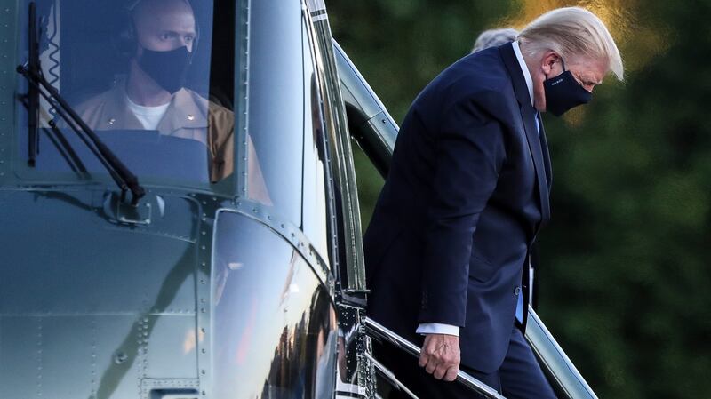 US president Donald Trump exits Marine One while arriving to Walter Reed National Military Medical Center in Bethesda, Maryland. Photograph: Oliver Contreras/EPA