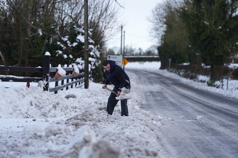 A man clears snow in Towlerton in Co Laois  as the cold snap continues in Ireland. Photograph: Niall Carson/PA Wire