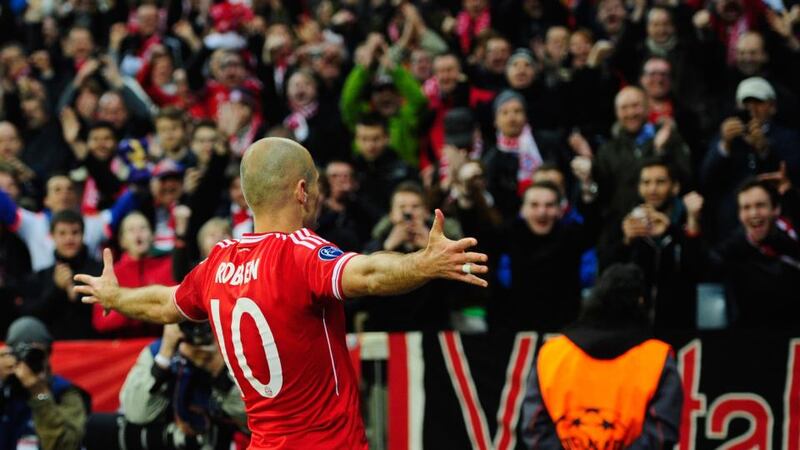 Arjen Robben celebrates landing the killer punch against Manchester United. Photograph: Lennart Preiss/Bongarts/Getty Images