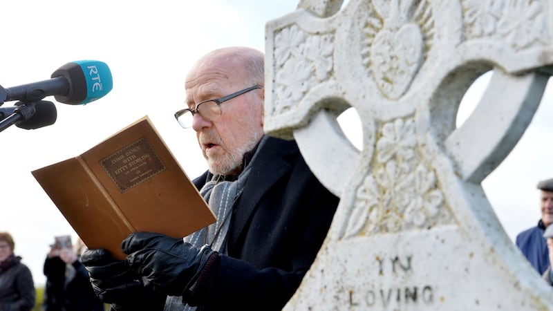 Eugene McCabe reads Come Dance with Kitty Stobling at the grave  of  Patrick Kavanagh in Inniskeen, Co Monaghan last November as part of a tribute to mark the 50th anniversary of the poet’s death. Photograph: Alan Betson