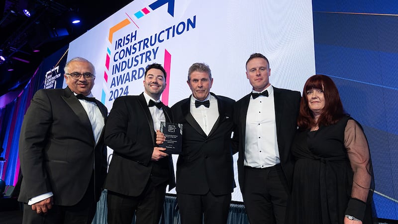 Brendan Doherty, director at Connex Offsite, presents the contractor residential project of the year award to the Jackie Greene Construction team