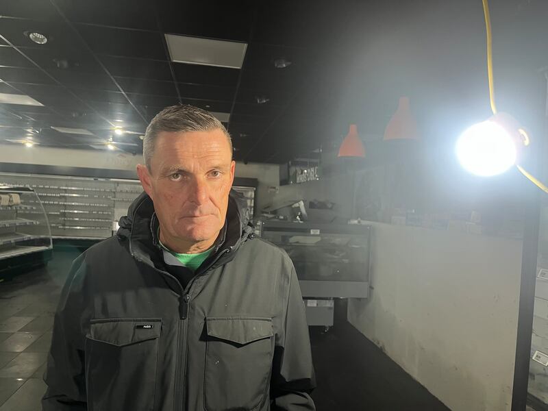 Ronan Hennigan has had to rig up temporary lights for the clean-up of his Londis supermarket in the Co Galway village of Clarinbridge after the shop was destroyed by the floods. Photograph: Harry McGee