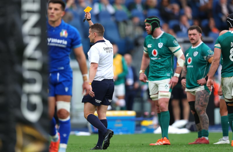 Referee Luke Pearce showing a yellow card to Michele Lamaro of Italy. Photograph: Billy Stickland/Inpho