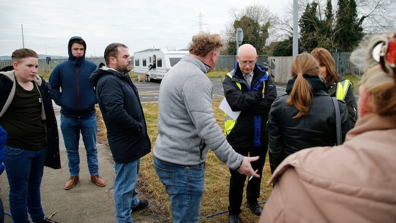 Residents of a halting site on the Balgaddy Road in  Clondalkin and their supporters speak to South Dublin County  Council officials at the site on Friday. Photograph: Nick Bradshaw/The Irish Times.