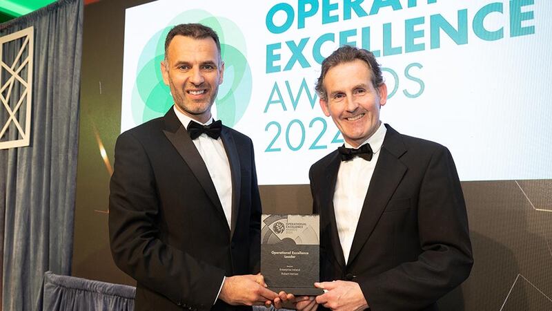 Eric Clinton, awards judge, presents the operational excellence leader to Robert Hernan, Enterprise Ireland