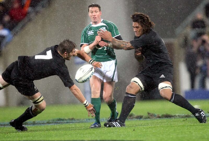 Ireland's Ronan O'Gara in action against New Zealand's Richie McCaw and Rodney So'oialo in 2008. Photograph: Billy Stickland/Inpho 