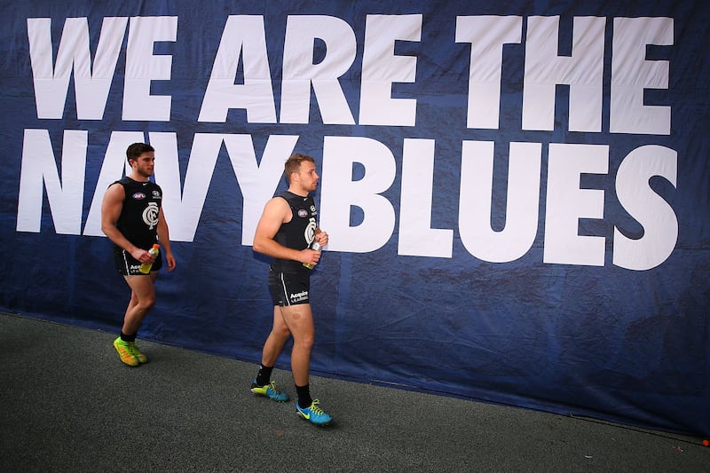 Ciáran Sheehan (right) leaves the pitch after a Carlton Blues win over Gold Coast Titans at Melbourne's Etihad Stadium in 2014. Photograph: Michael Dodge/Getty