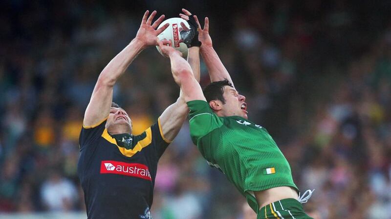 Australia’s Patrick Dangerfield competes in the air with Ireland’s Seán Cavanagh at Paterson Stadium in Perth. Photograph: Cathal Noonan / Inpho