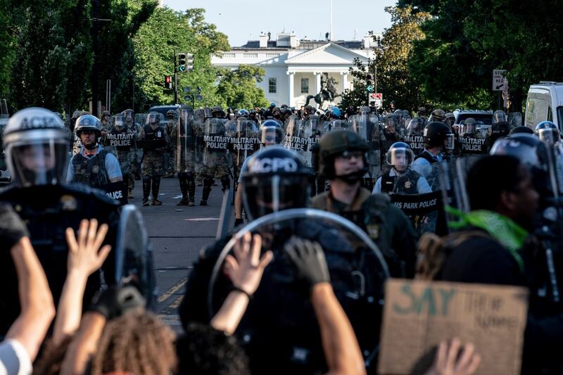 Police advance on protesters outside the White House in Washington on Monday, ahead of Donald Trump’s speech at St John’s Episcopal Church. Photograph: Erin Schaff/New York Times