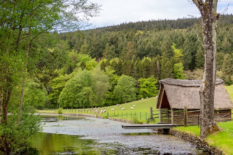 Thatched boathouse along the river