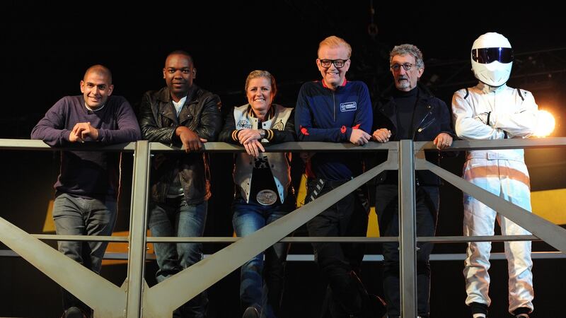 Top Gear presenters (left to right): Chris Harris, Rory Reid, Sabine Schmitz, Chris Evans, Eddie Jordan and The Stig. Evans says he is quitting the show.  File photograph: Andrew Matthews/PA Wire