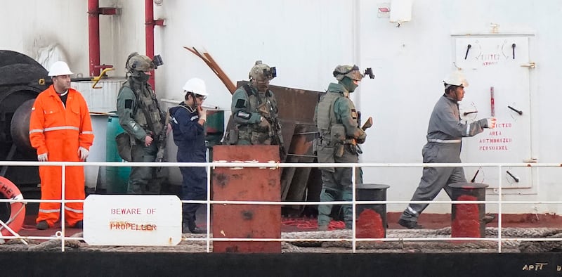 Military personnel onboard MV Matthew as the Irish Navy escorts it to Cobh. Photograph: Niall Carson/PA Wire 