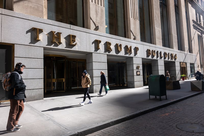 People walk by 40 Wall Street, a Trump-owned building in downtown Manhattan. Photograph: Spencer Platt/Getty Images