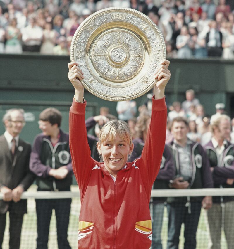 Martina Navratilova lefts the Wimbledon trophy after bearing Chris Evert in 1982. Photograph: Steve Powell/Allsport//Getty