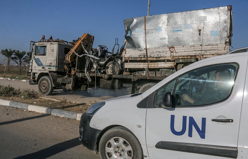 Gaza: A  truck that was used by workers of the United Nations Relief and Works Agency for Palestine Refugees  is loaded onto another truck after it was hit in an Israeli air strike. Photograph: Mohammed Saber/EPA