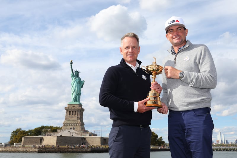 Luke Donald of England and Keegan Bradley of The United States pose for a photograph with the Ryder Cup trophy. Photograph: Andrew Redington/Getty