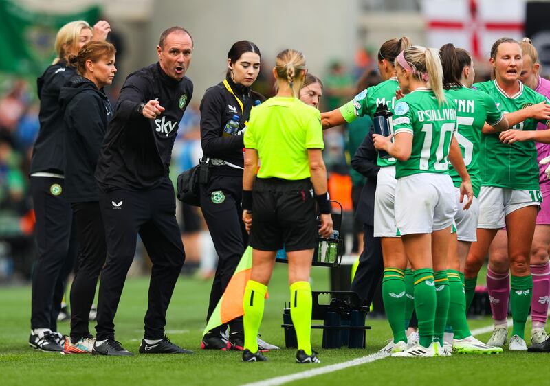 Former Republic of Ireland coach Colin Healy speaks to the team during a water break during the Nations League game against Northern Ireland in September 2023. Photograph: Ryan Byrne/Inpho 