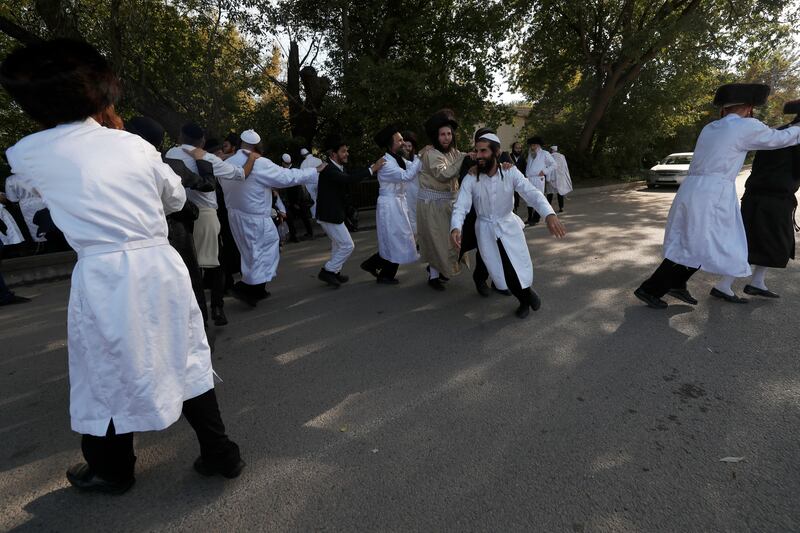 Ultra-orthodox Jewish pilgrims dance next to the river of Chykanka, marking Rosh Hashanah near the tomb of Rabbi Nachman in Uman, Ukraine. Photograph: Atef Safadi/EPA