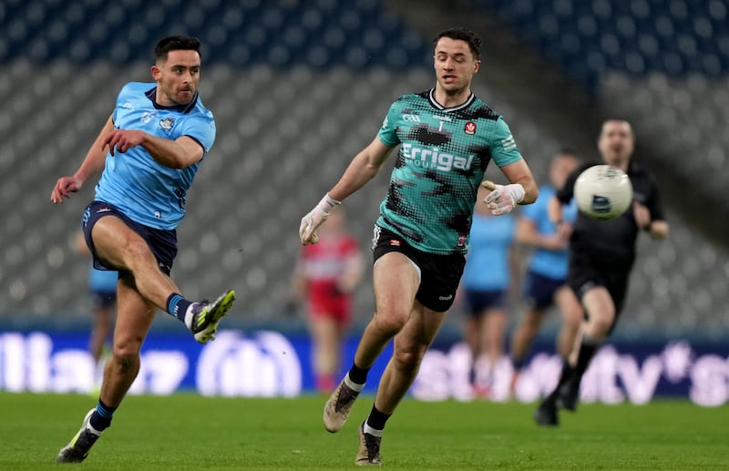 Dublin's Niall Scully fires the ball past Derry goalkeeper Neil McNicholl. Photograph: James Lawlor/Inpho 