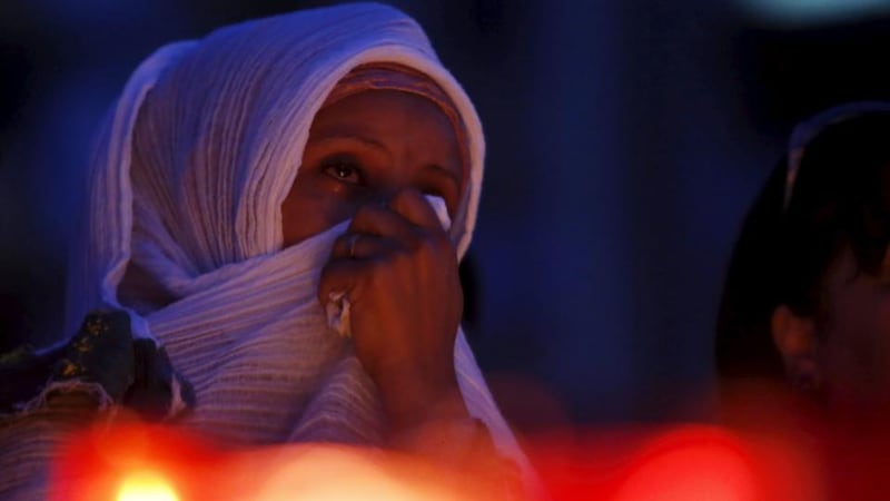 A woman cries during a candlelit vigil in Valletta, Malta to commemorate the up to 900 migrants who died in the Mediterranean on Sunday when their boat capsized. Reports say EU leaders are to reverse a decision to halt rescue operations in the Mediterranean at an emergency meeting on migration in the region. Photograph: Darrin Zammit Lupi/Reuters