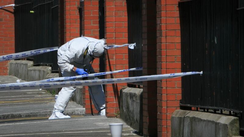 A garda searches for evidence after the killing of Gareth Hutch at North Cumberland Street, Dublin, May 24th, 206. Photo: Gareth Chaney/Collins