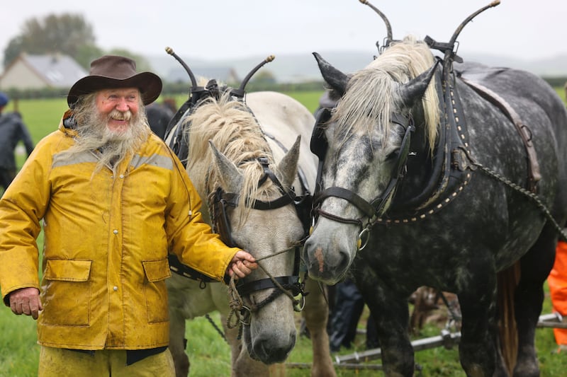 Gerry King from Co Kerry with horses Larry and Elton John, at the Horse Ploughing Championships. Photograph: Dara Mac Dónaill/The Irish Times