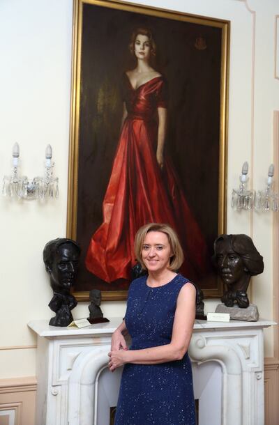 Liz Nugent under the portrait of Princess Grace in the Princess Grace library in Monaco