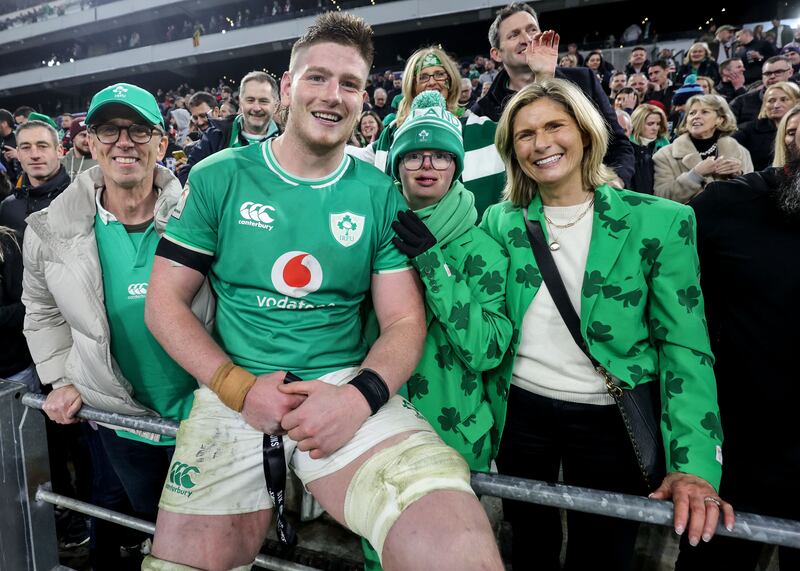 Ireland’s Joe McCarthy gives his player of the match medal to his brother Andrew alongside his father Joe and mother Paula. Photograph: Dan Sheridan/Inpho