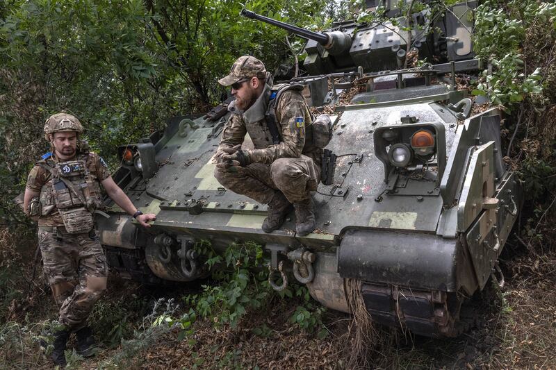 Ukrainian soldiers from the 47th Brigade with a Bradley Fighting Vehicle in Zaporizhzhia. Photograph: David Guttenfelder/The New York Times