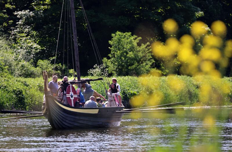 Viking Long Ships on the river Boyne at the Viking Festival, Boyne Valley Viking Experience has grown to become the largest Viking festival in Ireland. This year the theme is 'Norse-Irish Connections. Over 500 reenactors come to meet friends old and new, exchange stories & skills, sell their goods, fight on the battlefield and sail long ships on the River Boyne in the shadow of the famous Slane Castle, Co Meath. Photograph: Dara Mac Dónaill / The Irish Times