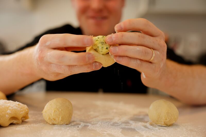 Wrap the chilled garlic butter in the brioche dough. Photograph: Alan Betson.

