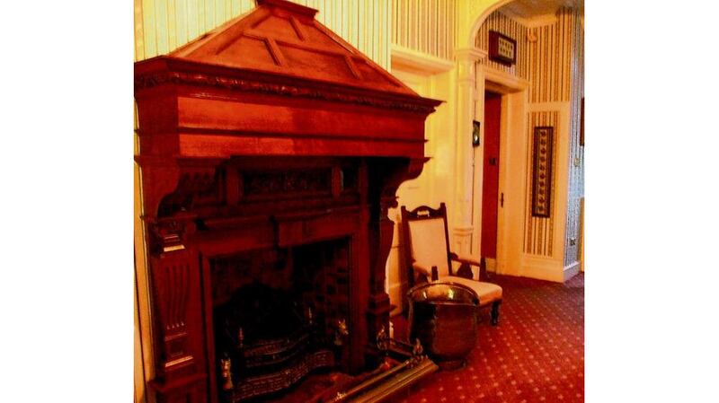 An imposing oak fireplace