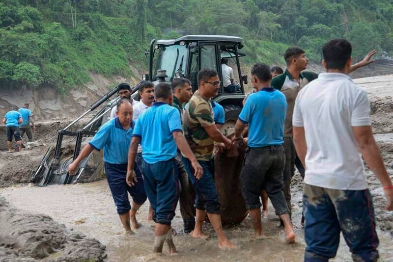 Rescue work following the flash floods which have killed at least 14 people. Photograph: Prakash Adhikari/AP/PA