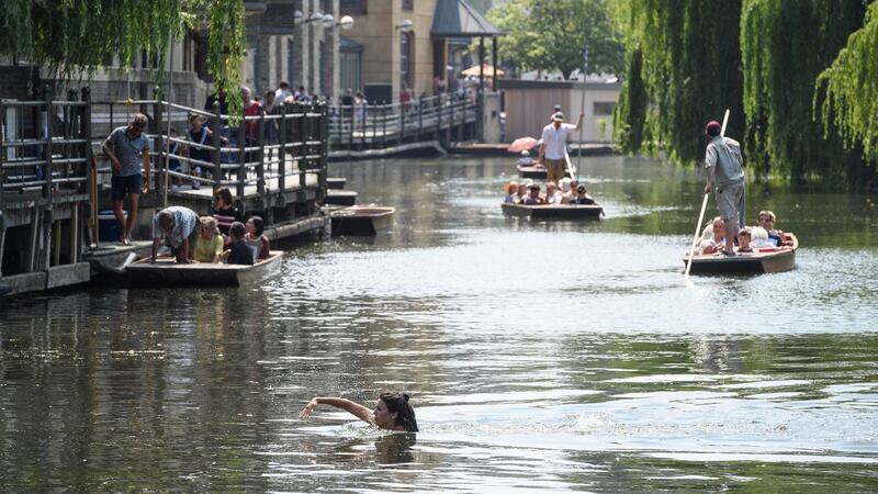 A woman swims in the River Cam  in Cambridge on Thursday: Photograph: Leon Neal/Getty Images