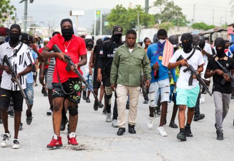 Former police officer Jimmy 'Barbecue' Cherizier, leader of the G-9 coalition of gangs, leads a march surrounded by his security against Haiti's prime minister Ariel Henry, in Port-au-Prince, Haiti. Photograph: Ralph Tedy Erol