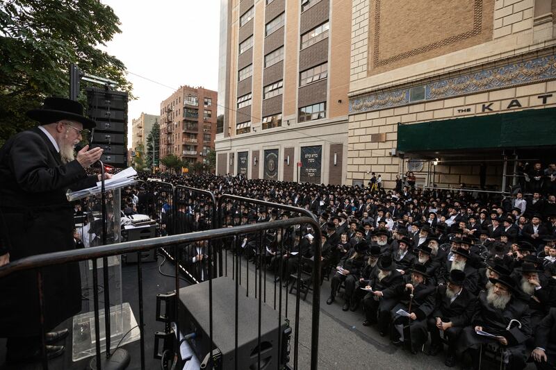 Members of the ultra-Orthodox and Hasidic Jewish communities hold an outdoor prayer service in  Brooklyn, New York for the recent events in Israel and Gaza. Photograph: Benjamin Norman/New York Times
                      