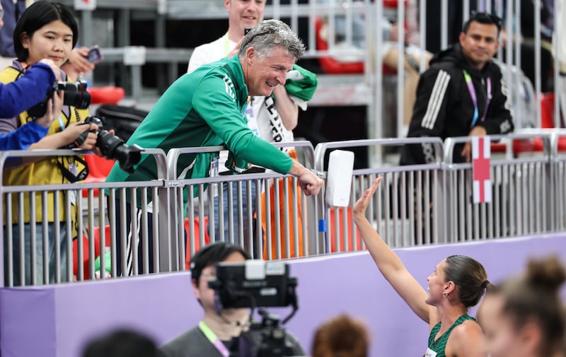 She celebrates with her coach and father Michael O'Connor. Photograph: Nikola Krstic/Inpho