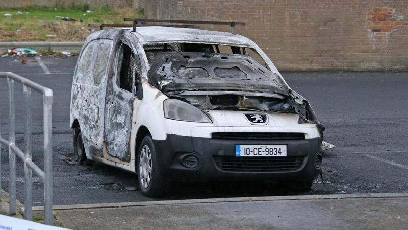 A burnt out car which garadí believe was used by those who carried out a fatal shooting in Ronanstown. Photograph: Colin Keegan/Collins Dublin.