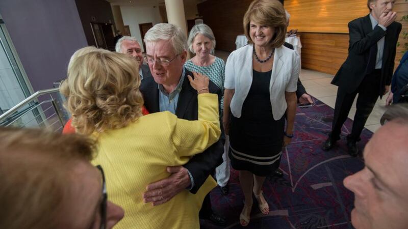 Labour Party leader and Tánaiste Joan Burton watches former  leader Eamon Gilmore  with Senator Mary Moran during the party’s pre-autumn parliamentary meeting held at White’s Hotel, Wexford. Photograph: Brenda Fitzsimons/The Irish Times