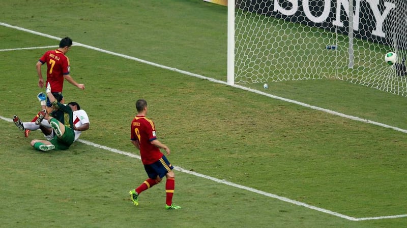 Spain’s David Villa (left) scores his team’s fourth in Rio de Janeiro. Photograph: Satiro Sodre/Reuters