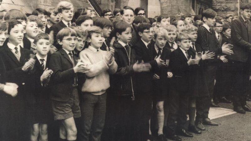 A group of Bunscoil students applaud President de Valera as he arrives for the school’s centenary celebrations in 1963