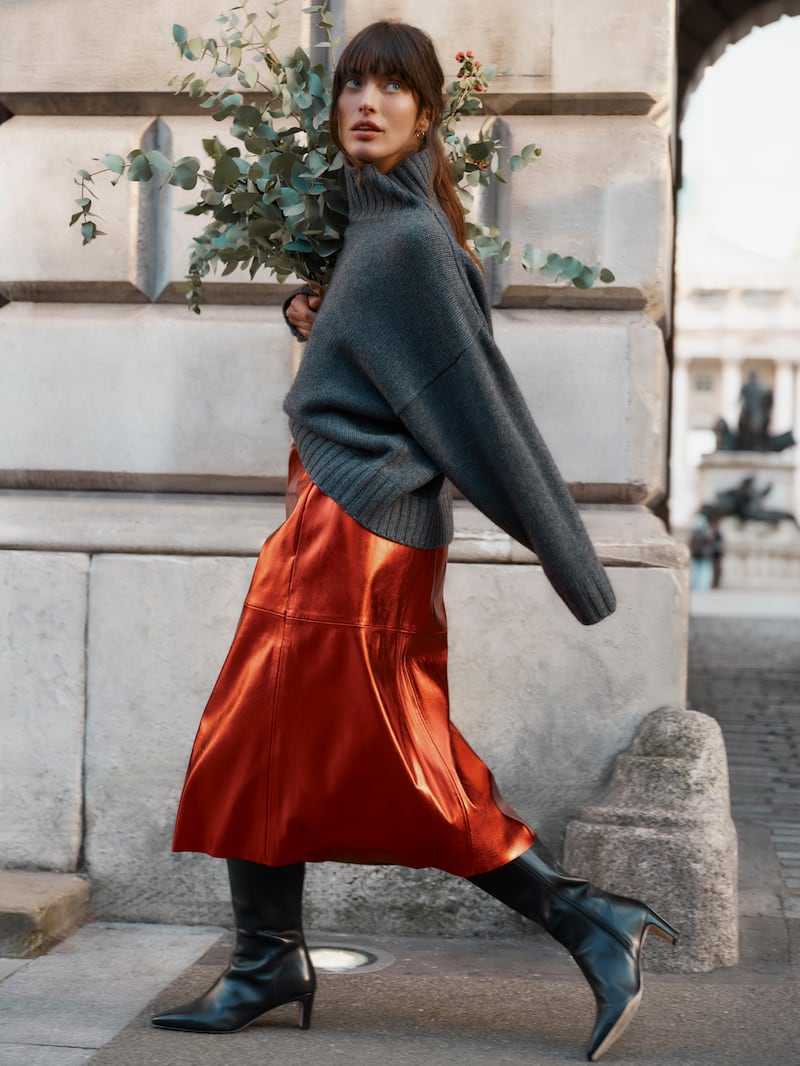 Knitted jumper, €425; red metallic skirt, €350; both Wyse London