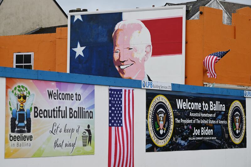 A mural of Biden and other welcome signs on the sides of buildings in Ballina prior to his visit on Friday. Photograph: Leon Neal/Getty