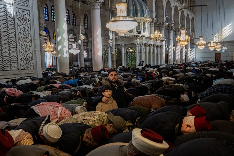 Some of the thousands gathered at the Umayyad Mosque in Damascus. Photograph: Daniel Berehulak/The New York Times
                      