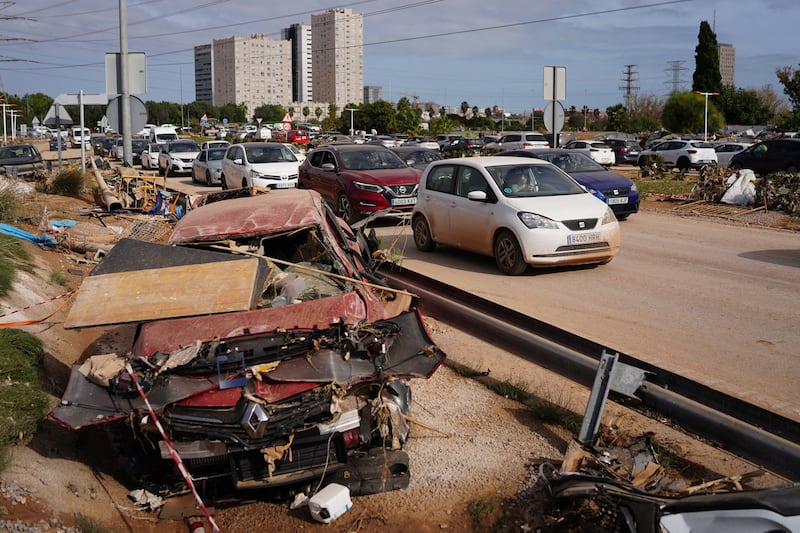 Wreckage of cars are spread on the sides of a road in Paiporta, Valencia in eastern Spain. Photograph: Manaure Quintero/AFP/Getty Images